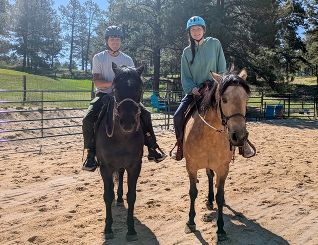 Two riders in arena